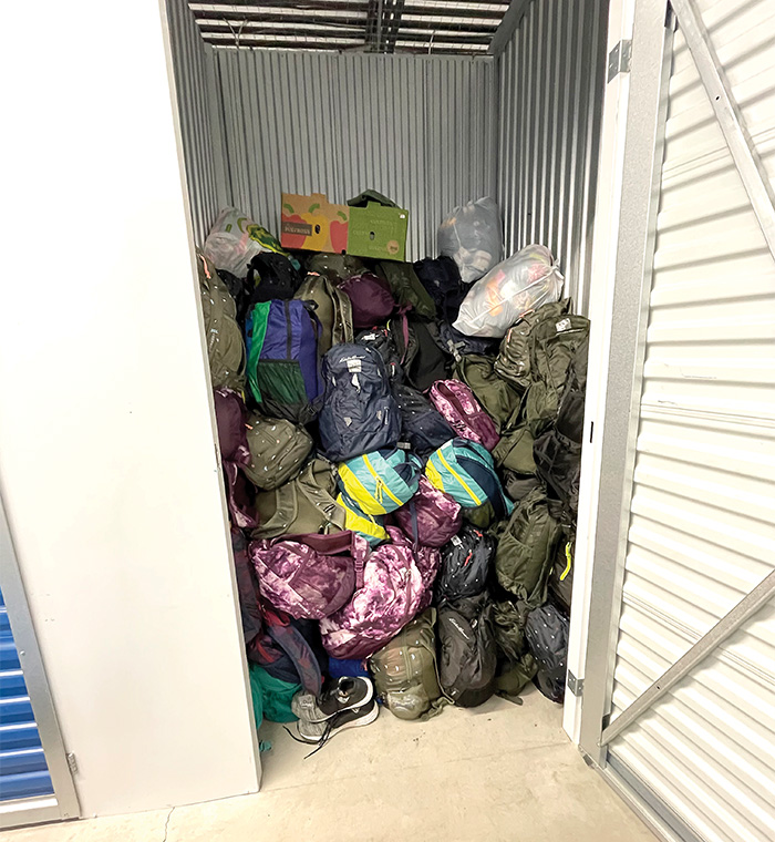 Due to not always being able to hand out all of backpacks during her summer trips, Khristina stores them in a storage locker in Chilliwack to give them out when she flies down during the winter and spring. 